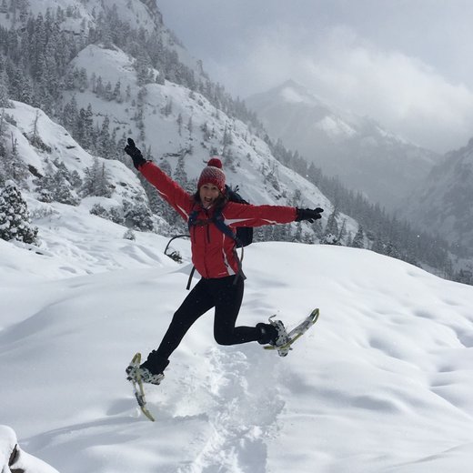 Cindy Jennings snowshoeing in the mountains